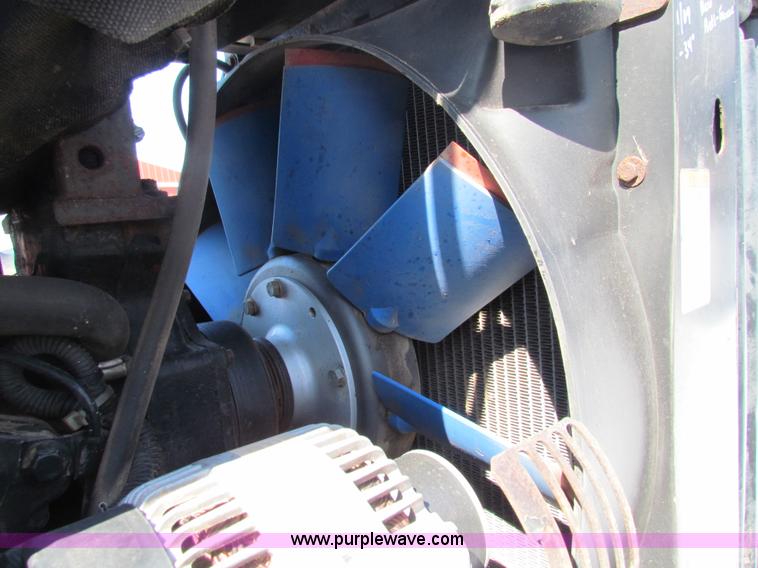 image for item I7489 2006 New Holland TV145 MFWD Bi-directional tractor