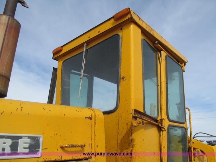 image for item I7153 1980 John Deere 770A articulated motor grader