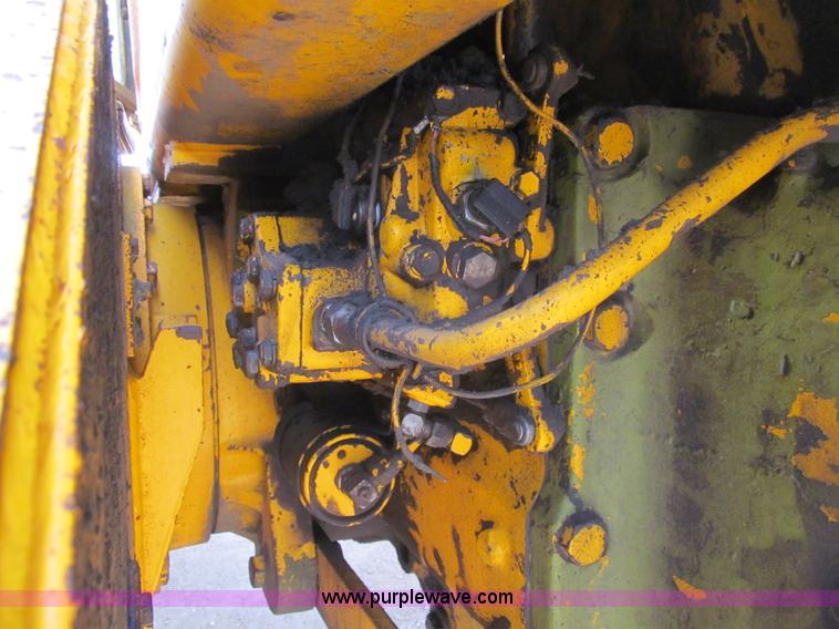 image for item I7153 1980 John Deere 770A articulated motor grader