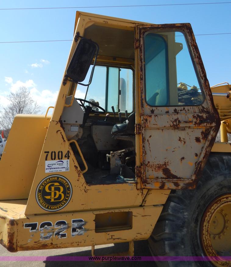 image for item H3478 1993 John Deere 762B paddle scraper