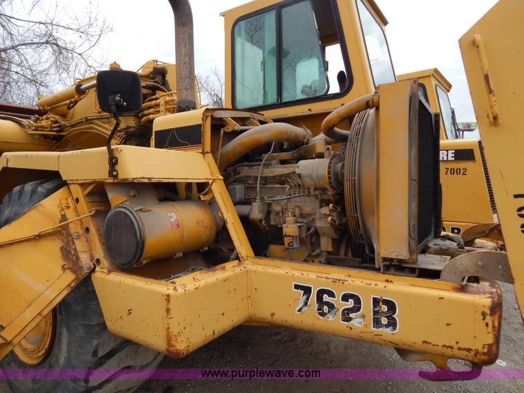 image for item H3478 1993 John Deere 762B paddle scraper