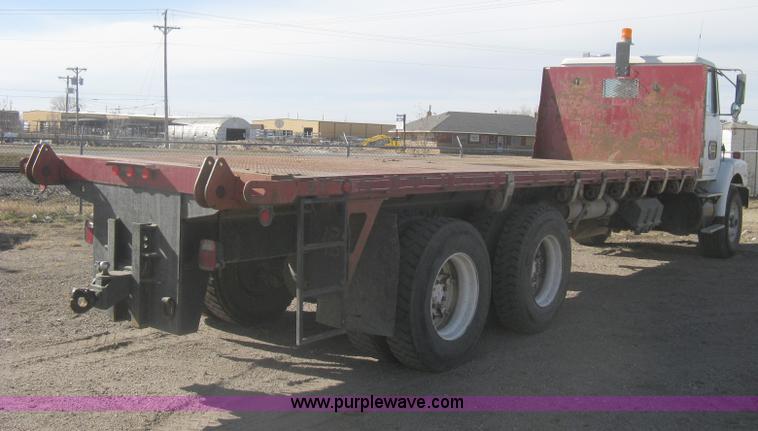 image for item I5551 1997 Volvo WGM25 flatbed truck