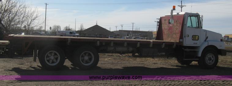 image for item I5551 1997 Volvo WGM25 flatbed truck
