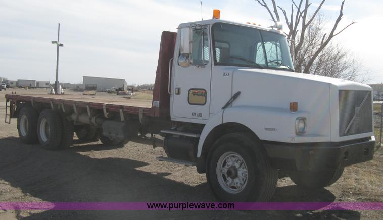 image for item I5551 1997 Volvo WGM25 flatbed truck