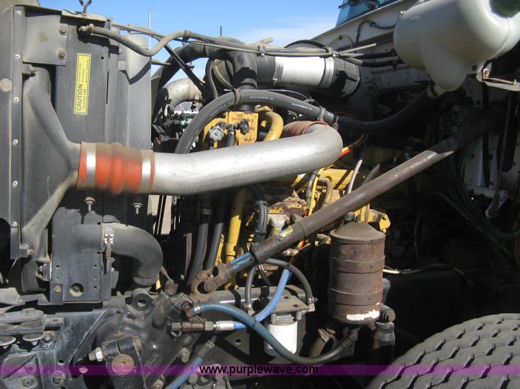 image for item I5551 1997 Volvo WGM25 flatbed truck