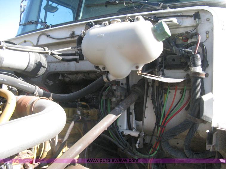 image for item I5551 1997 Volvo WGM25 flatbed truck