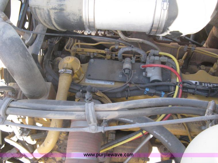 image for item I5551 1997 Volvo WGM25 flatbed truck