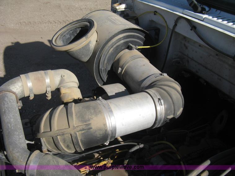 image for item I5551 1997 Volvo WGM25 flatbed truck