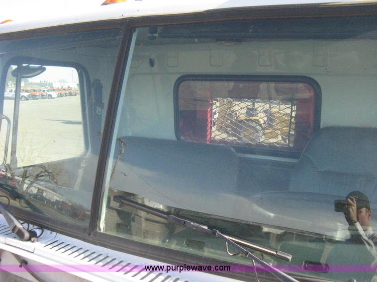 image for item I5551 1997 Volvo WGM25 flatbed truck