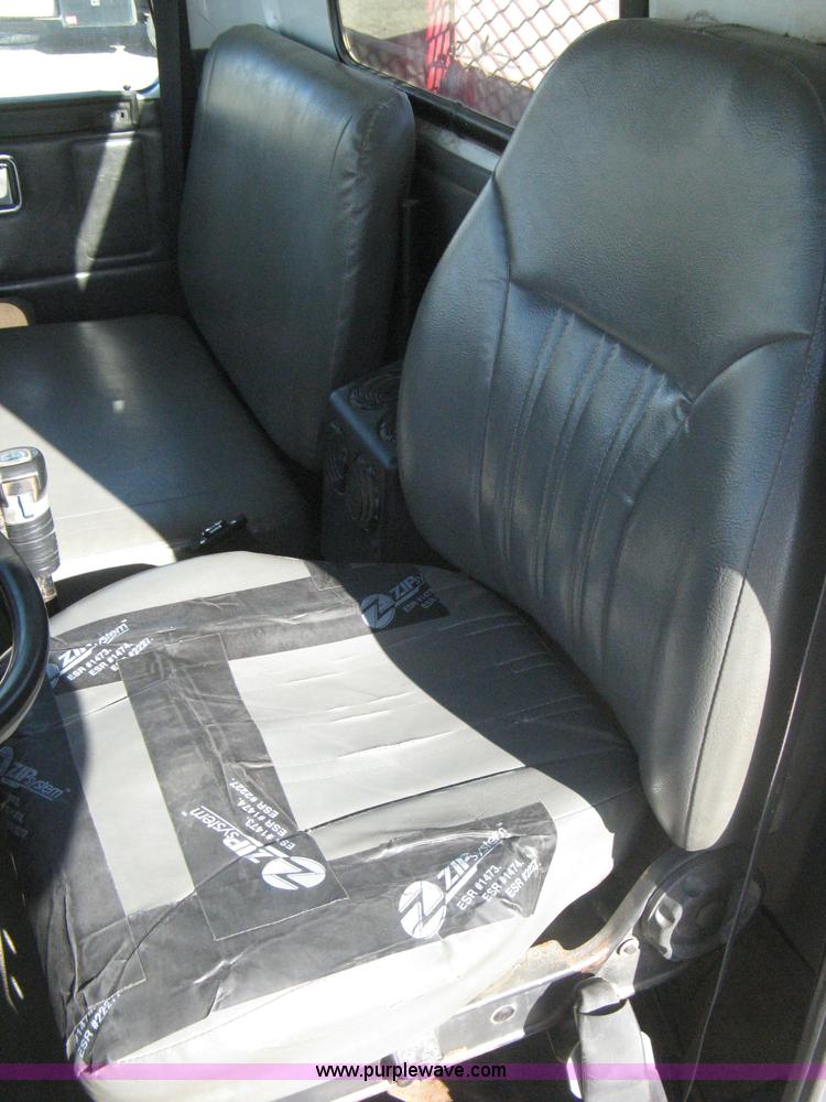 image for item I5551 1997 Volvo WGM25 flatbed truck