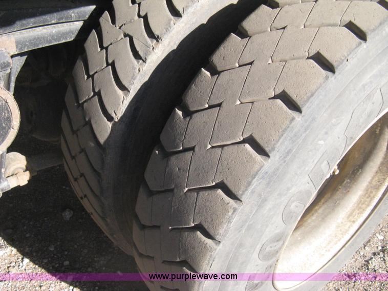 image for item I5551 1997 Volvo WGM25 flatbed truck