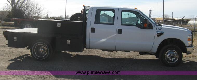image for item I5555 2009 Ford F350 Super Duty XL Crew Cab flatbed truck