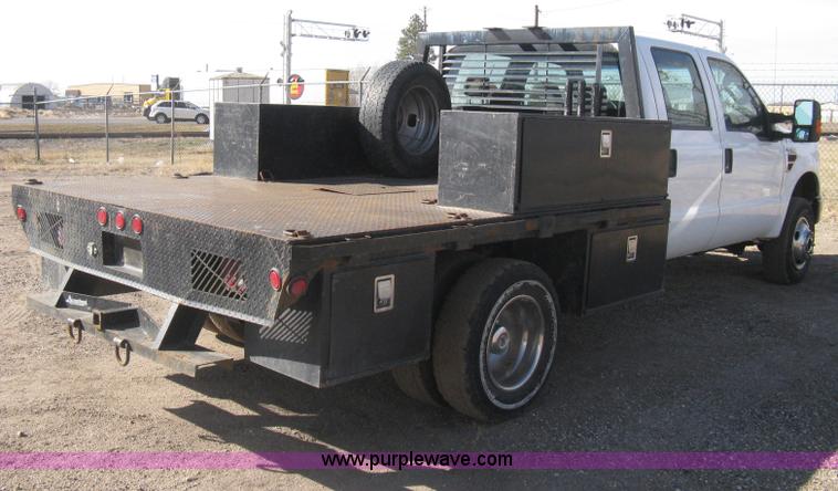 image for item I5555 2009 Ford F350 Super Duty XL Crew Cab flatbed truck