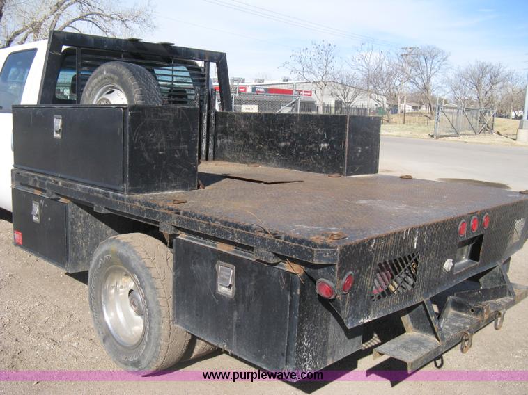 image for item I5555 2009 Ford F350 Super Duty XL Crew Cab flatbed truck