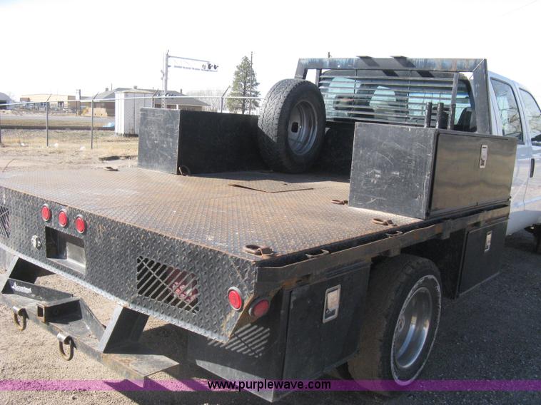 image for item I5555 2009 Ford F350 Super Duty XL Crew Cab flatbed truck