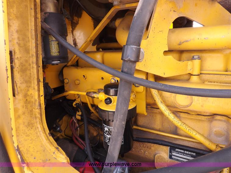 image for item I9005 1993 John Deere 710D backhoe