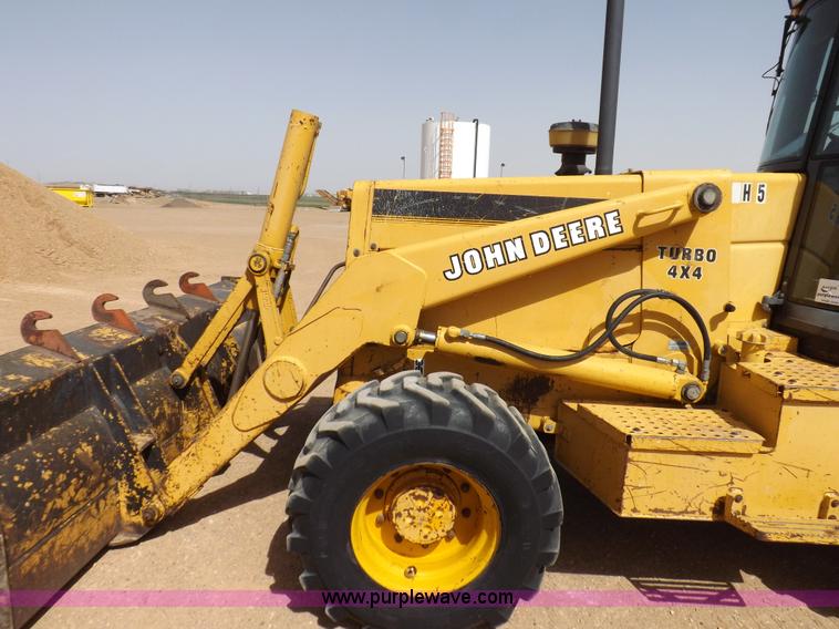 image for item I9005 1993 John Deere 710D backhoe