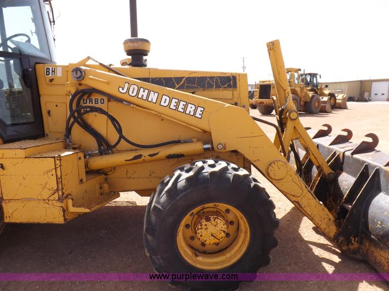 image for item I9005 1993 John Deere 710D backhoe