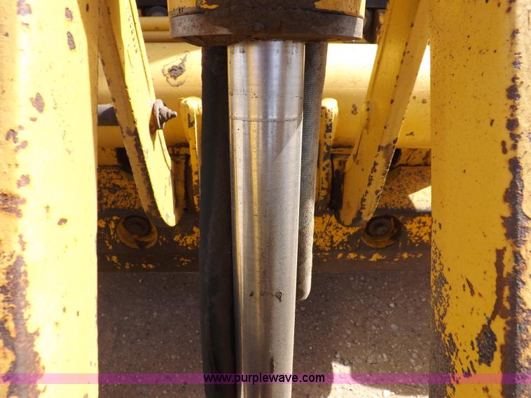 image for item I9005 1993 John Deere 710D backhoe