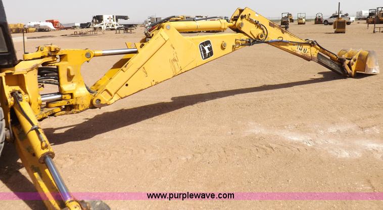 image for item I9005 1993 John Deere 710D backhoe