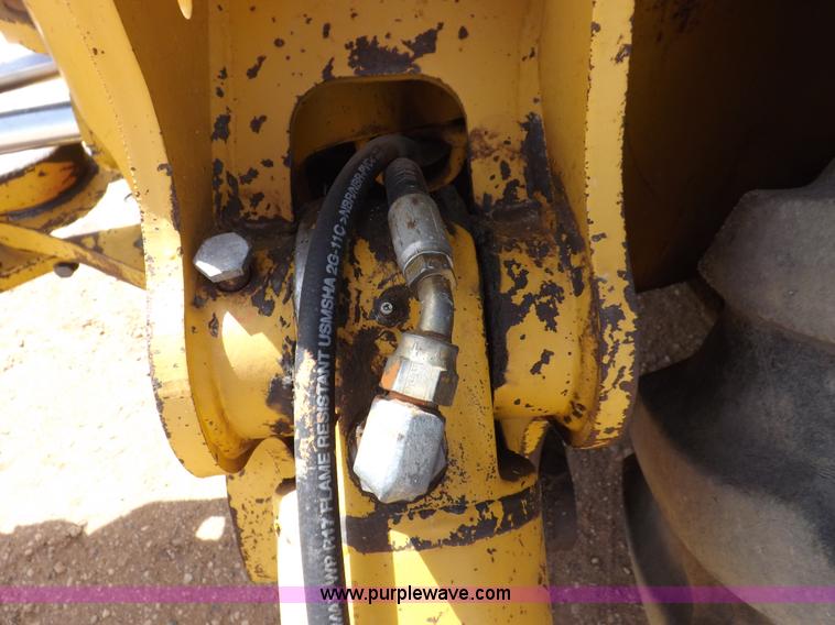 image for item I9005 1993 John Deere 710D backhoe