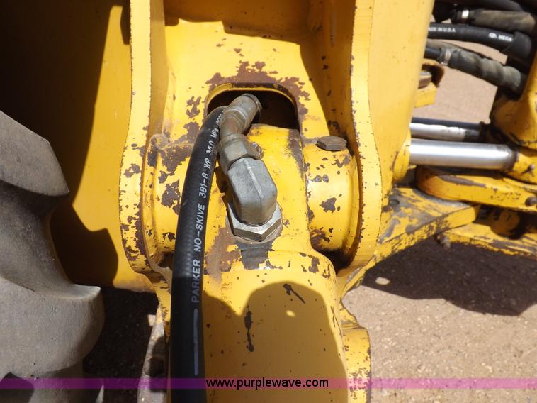 image for item I9005 1993 John Deere 710D backhoe