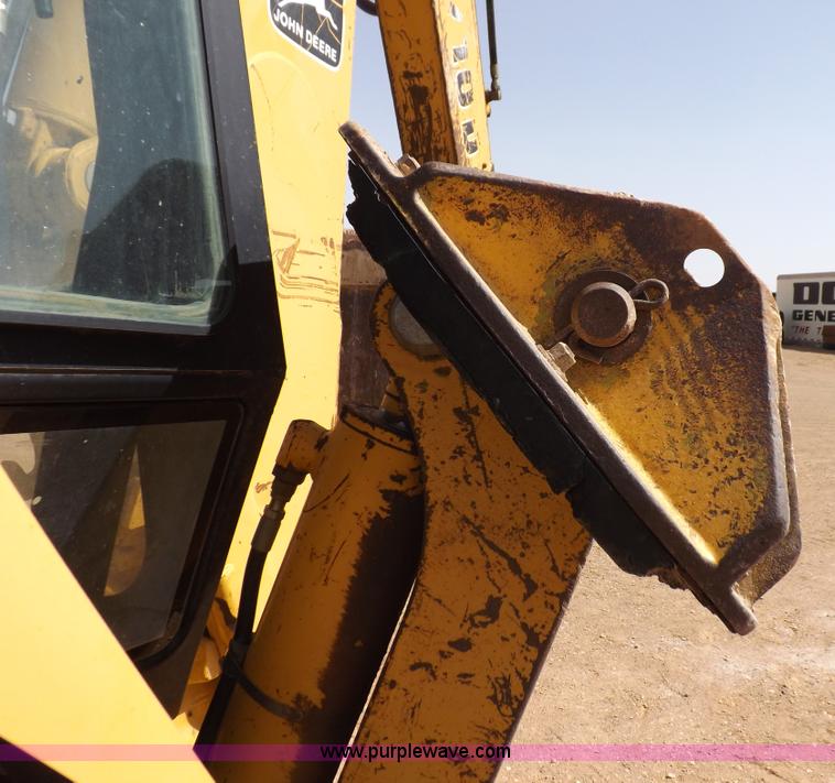 image for item I9005 1993 John Deere 710D backhoe