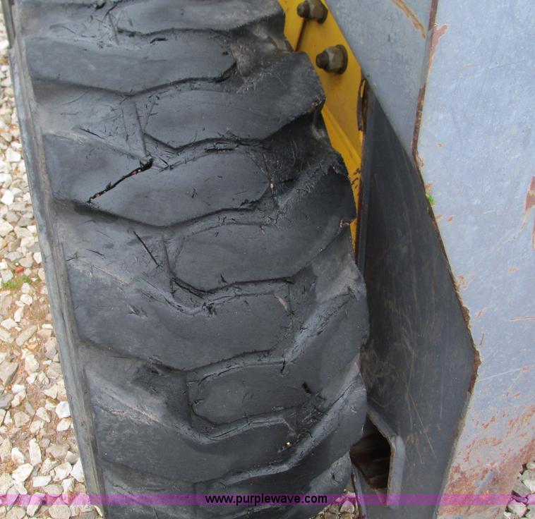 image for item G9334 2000 New Holland LS180 skid steer