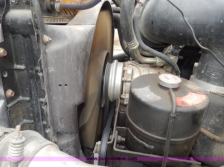 image for item H6186 1990 Ford F700 Crew Cab flatbed truck