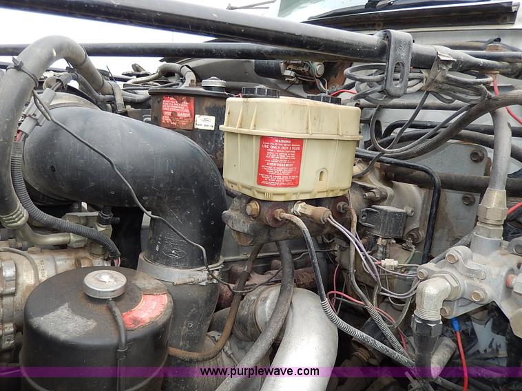 image for item H6186 1990 Ford F700 Crew Cab flatbed truck