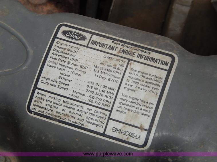 image for item H6186 1990 Ford F700 Crew Cab flatbed truck