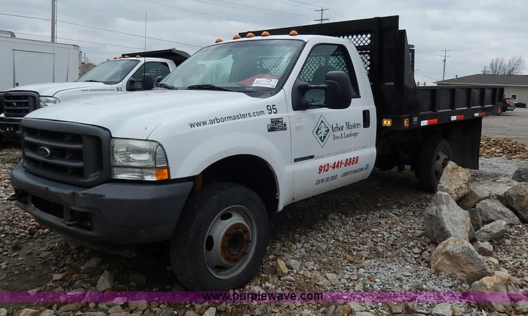 image for item I3708 2002 Ford F450 Super Duty XL flatbed pickup truck