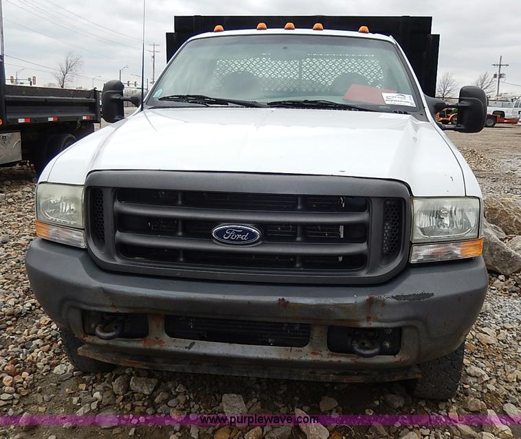 image for item I3708 2002 Ford F450 Super Duty XL flatbed pickup truck