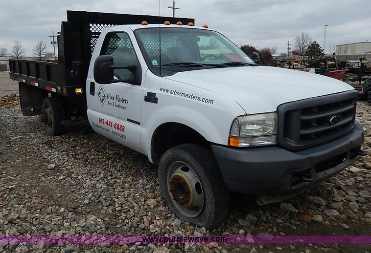 image for item I3708 2002 Ford F450 Super Duty XL flatbed pickup truck