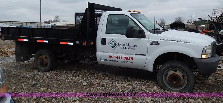 image for item I3708 2002 Ford F450 Super Duty XL flatbed pickup truck