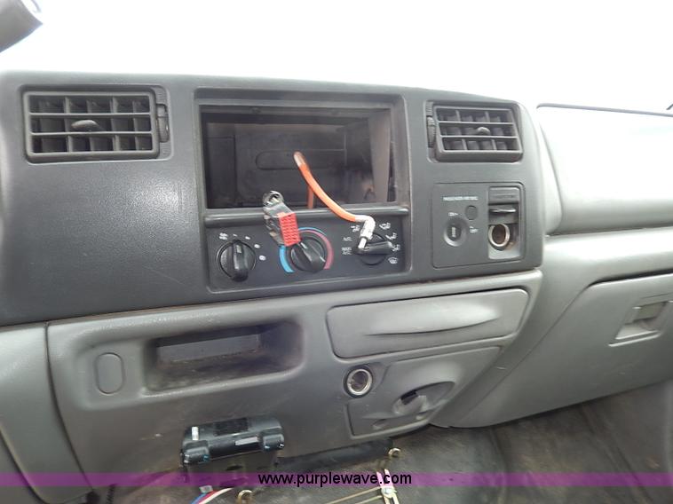 image for item I3708 2002 Ford F450 Super Duty XL flatbed pickup truck