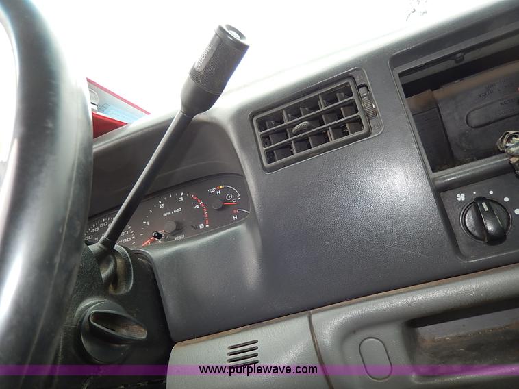 image for item I3708 2002 Ford F450 Super Duty XL flatbed pickup truck