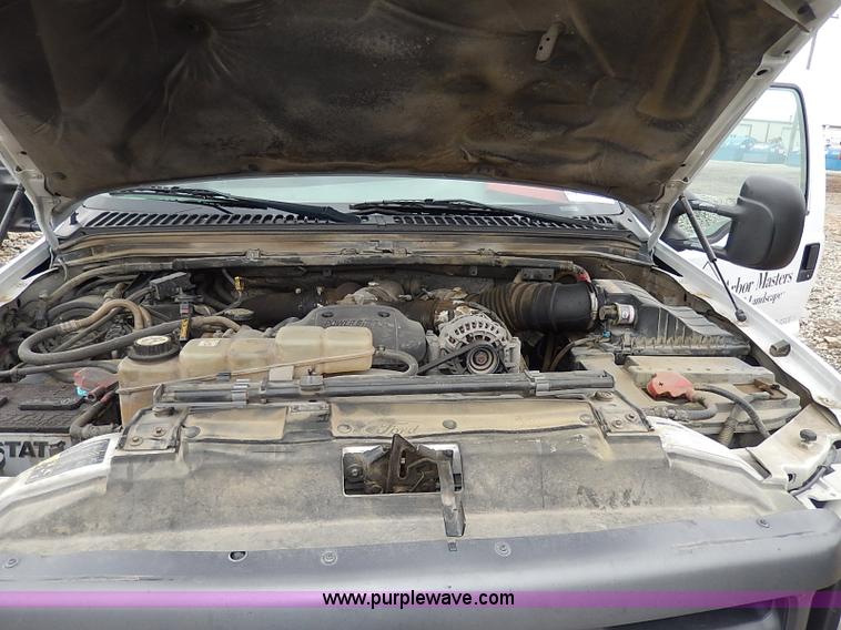 image for item I3708 2002 Ford F450 Super Duty XL flatbed pickup truck