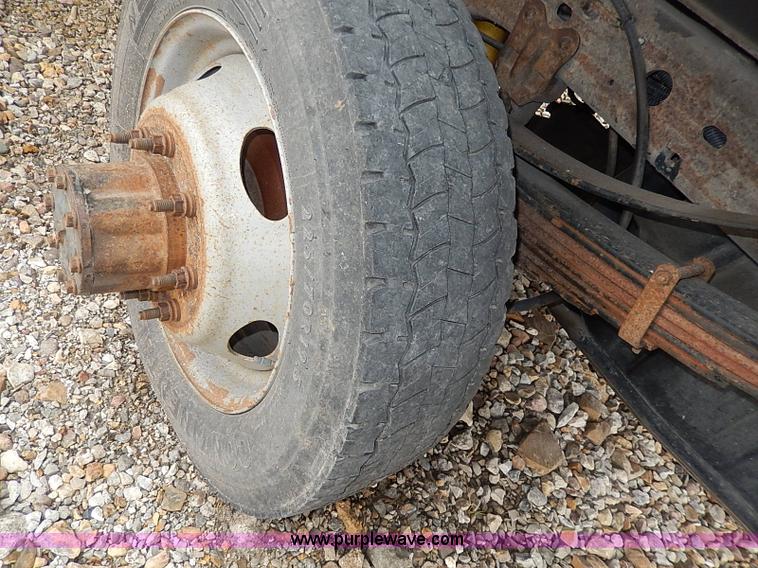 image for item I3708 2002 Ford F450 Super Duty XL flatbed pickup truck