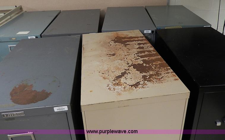 image for item AC9179 (8) four drawer metal filing cabinets