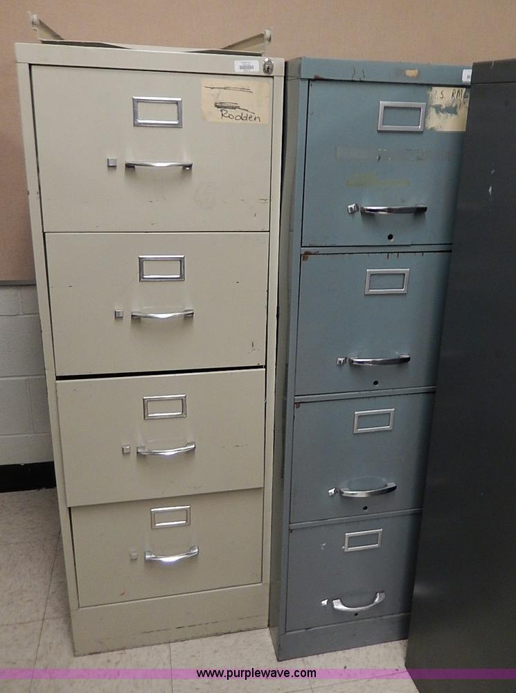 image for item AC9179 (8) four drawer metal filing cabinets