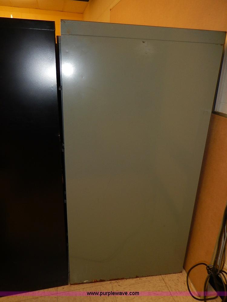 image for item AC9179 (8) four drawer metal filing cabinets