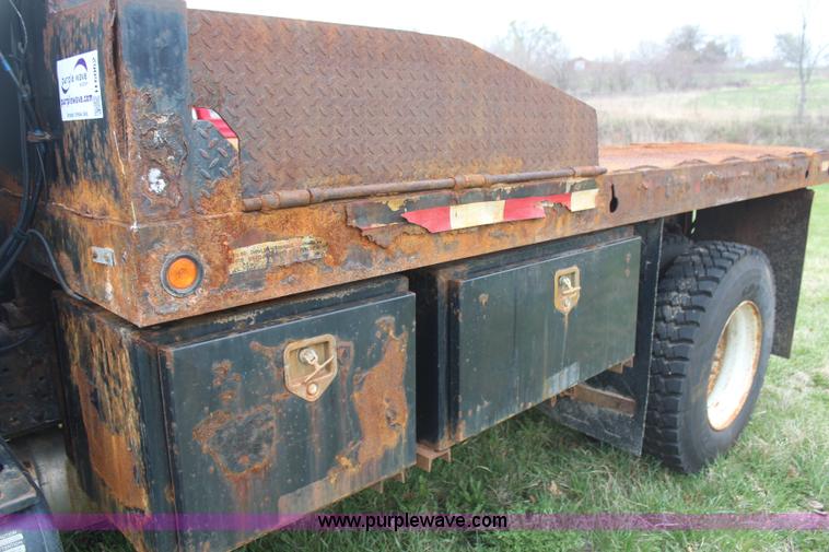 image for item H6062 2000 GMC C8500 flatbed truck