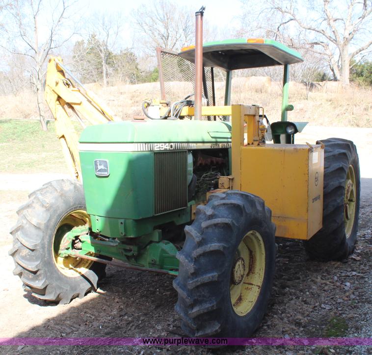image for item H6218 1980 John Deere 2940 MFWD tractor with boom mower
