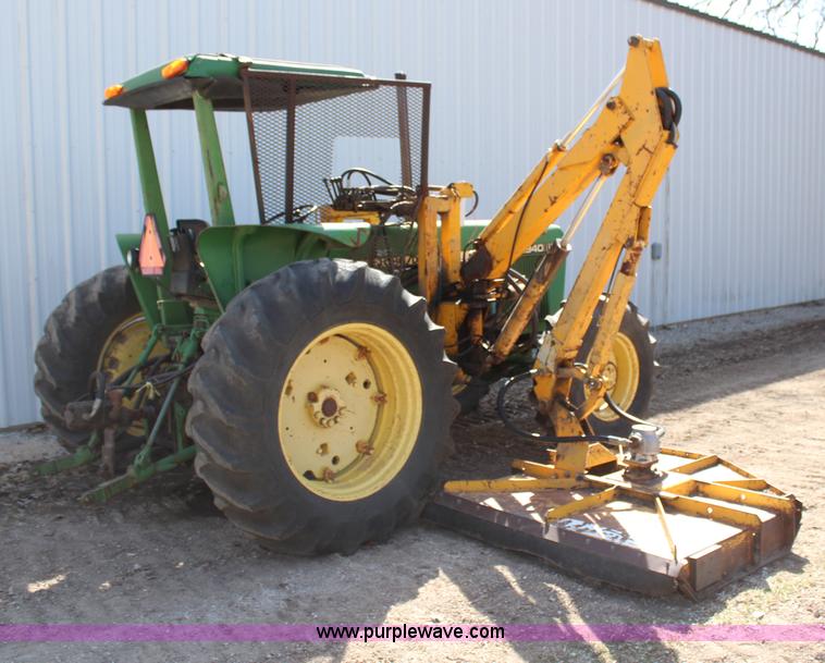 image for item H6218 1980 John Deere 2940 MFWD tractor with boom mower