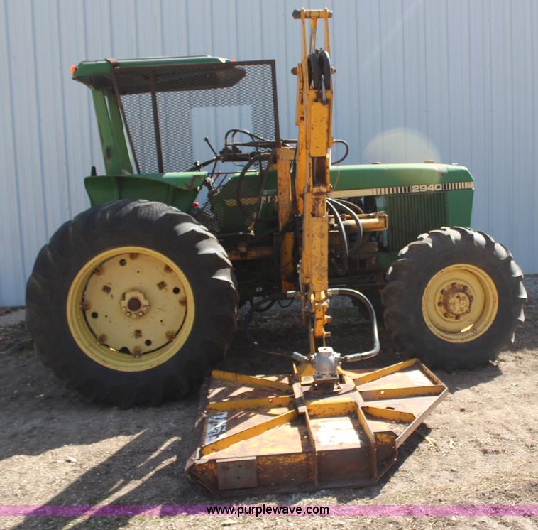 image for item H6218 1980 John Deere 2940 MFWD tractor with boom mower