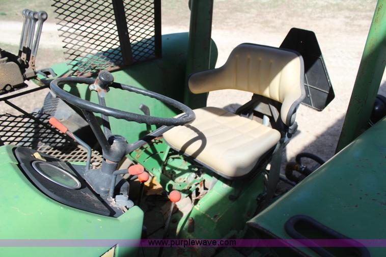 image for item H6218 1980 John Deere 2940 MFWD tractor with boom mower
