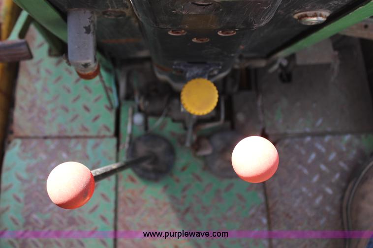 image for item H6218 1980 John Deere 2940 MFWD tractor with boom mower