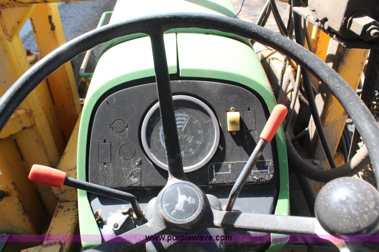 image for item H6218 1980 John Deere 2940 MFWD tractor with boom mower