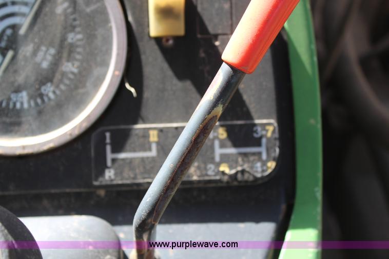 image for item H6218 1980 John Deere 2940 MFWD tractor with boom mower